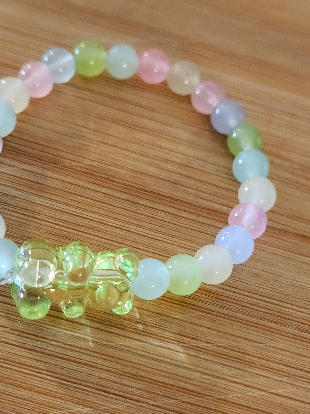Hand Crafted Pastel Beaded Stretch Bracelet with Green Bear Charm